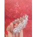 Свадебная корона оформлена кристаллами и стеклярусом.